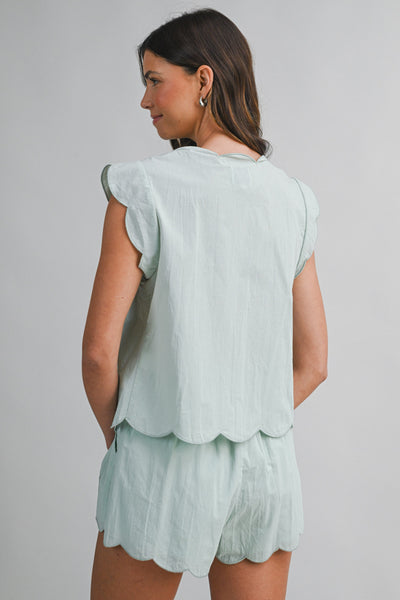 Blusa cordones y flores