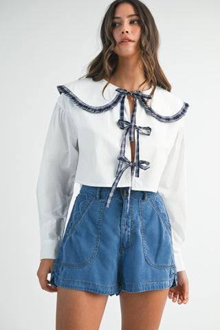 Blusa manga larga cuello y lazos