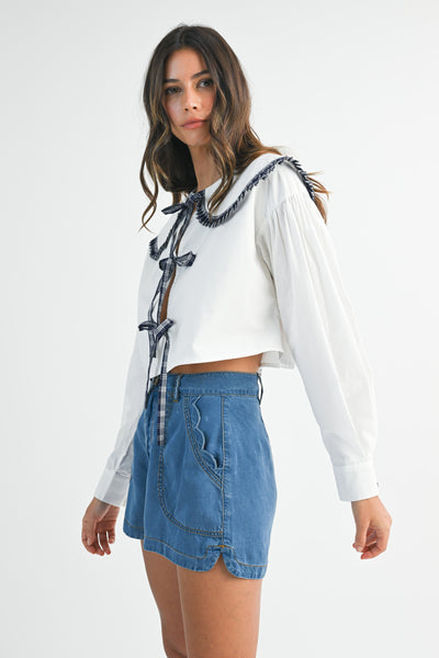 Blusa manga larga cuello y lazos