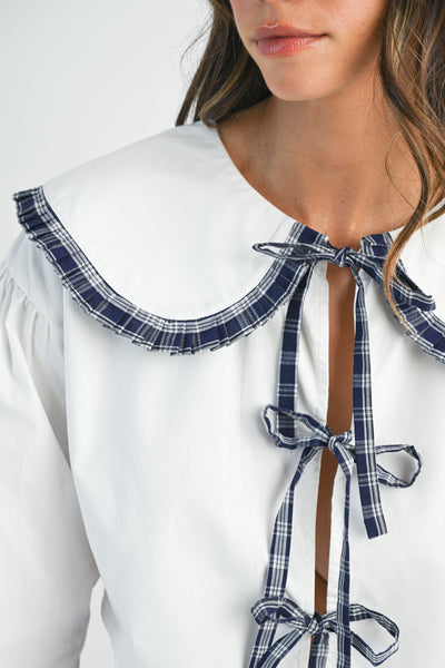 Blusa manga larga cuello y lazos