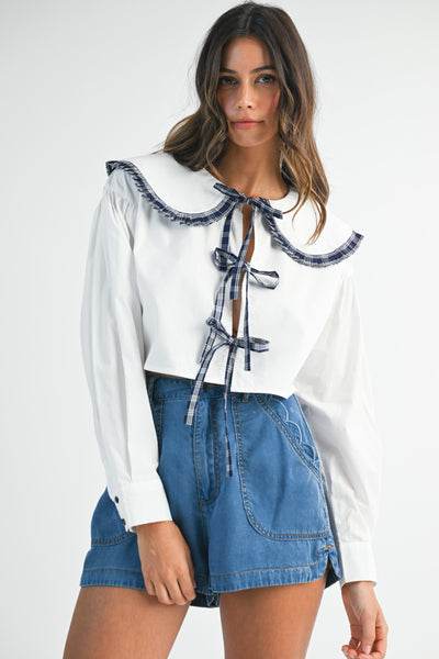 Blusa manga larga cuello y lazos
