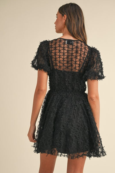 Vestido  mini transparencia manga abullonada